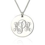 Engraved sterling silver disc necklace showcasing initials