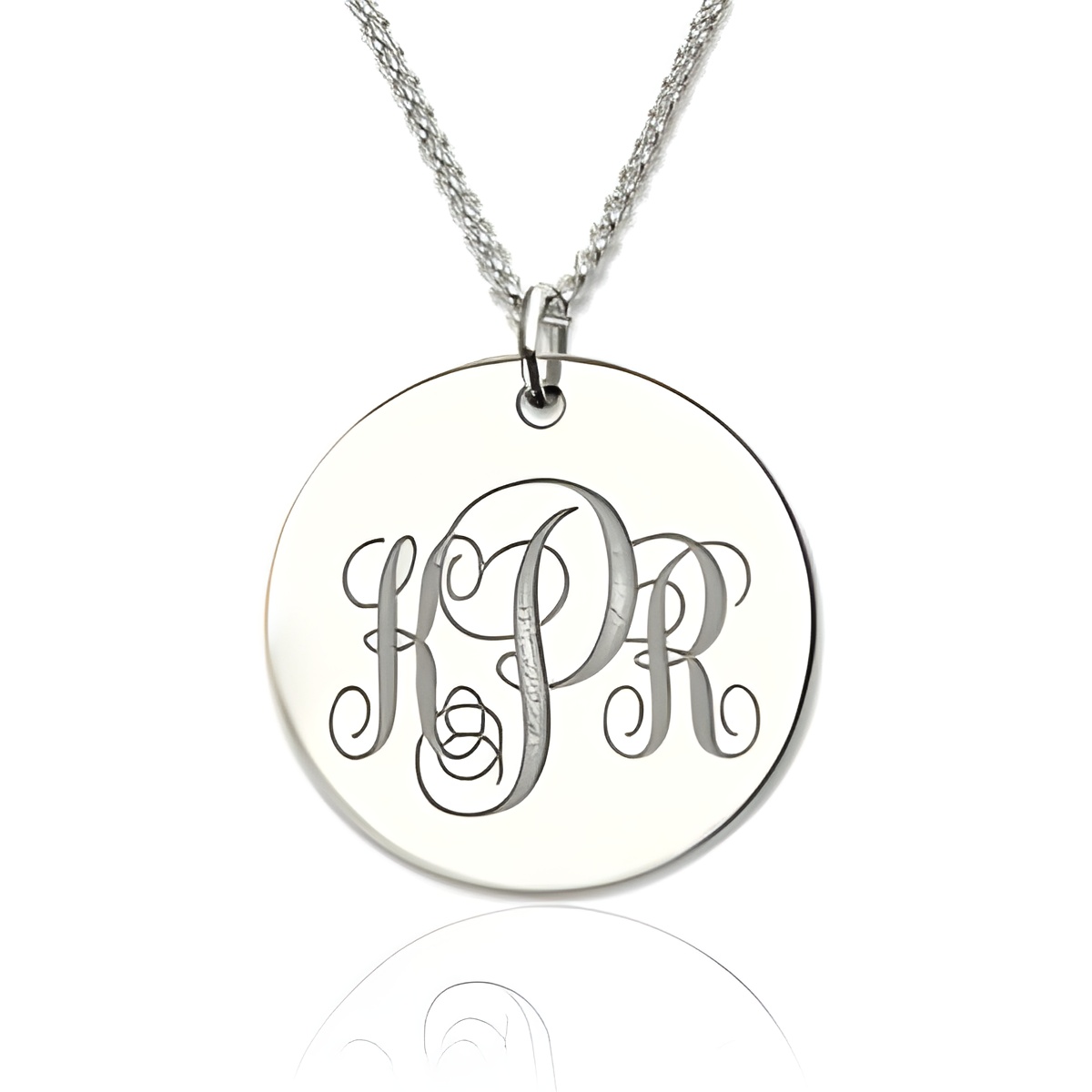 Engraved sterling silver disc necklace showcasing initials