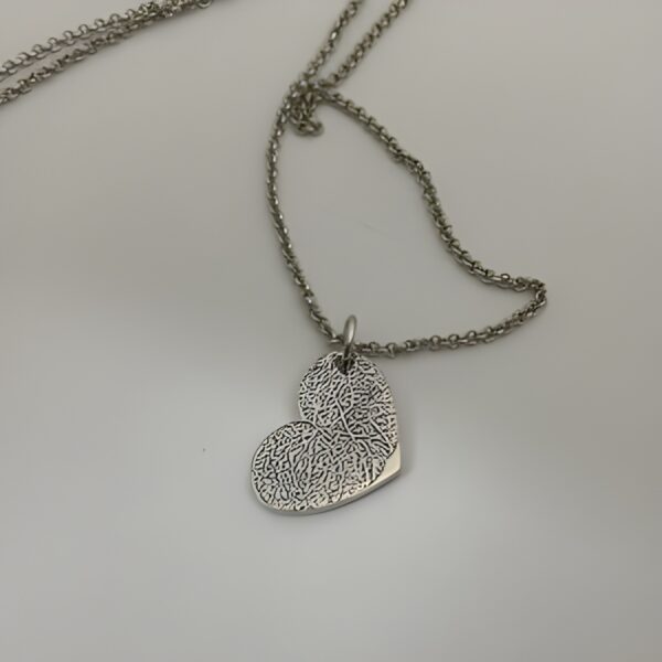 Fingerprint Heart Necklace symbolizing love and connection