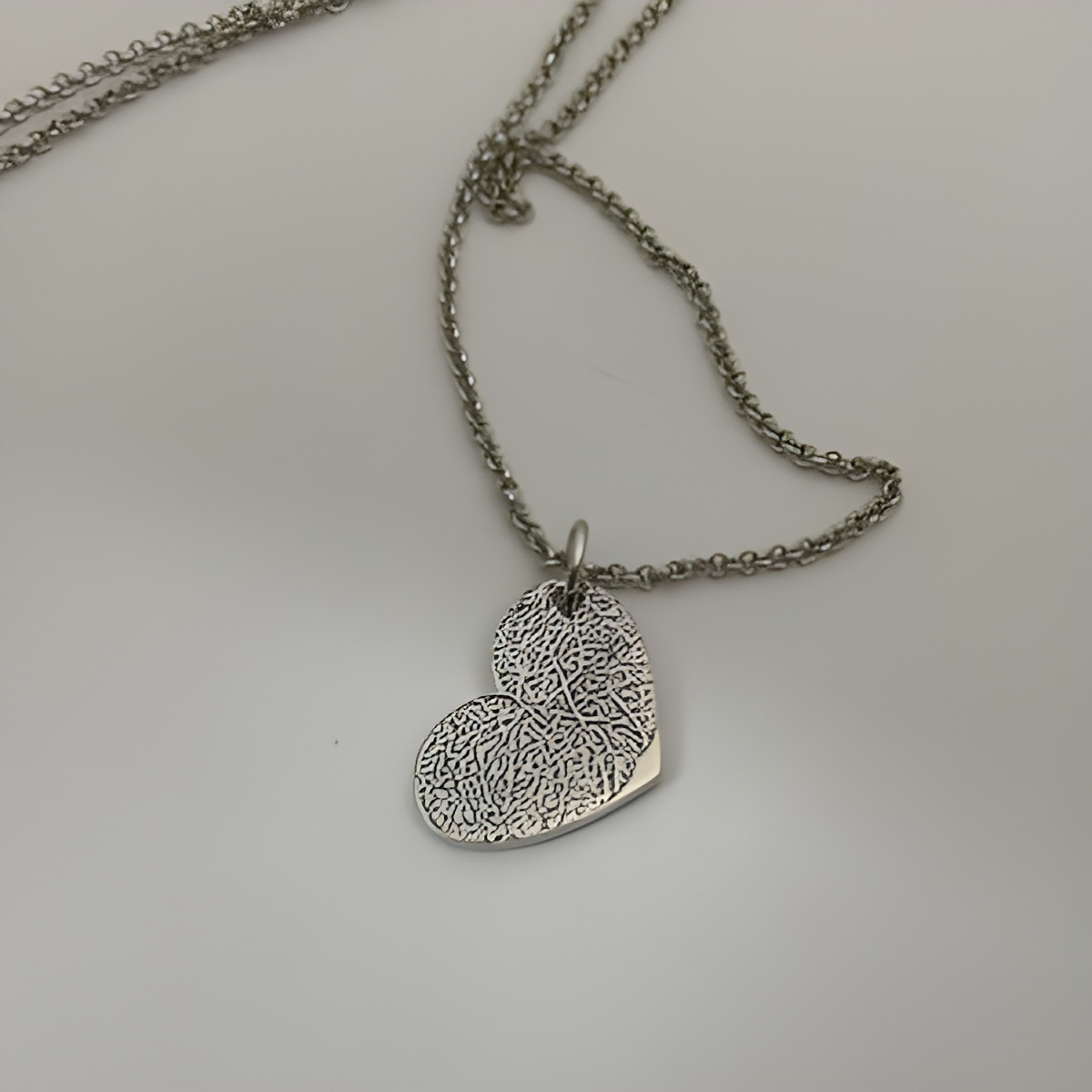 Fingerprint Heart Necklace symbolizing love and connection