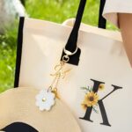 Personalized daisy hat clip with initial charm
