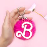Personalized pink acrylic keychain with initial charm