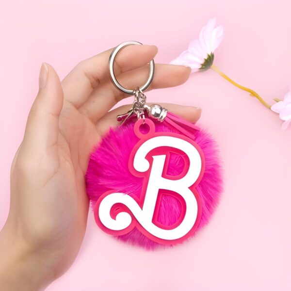 Personalized pink acrylic keychain with initial charm